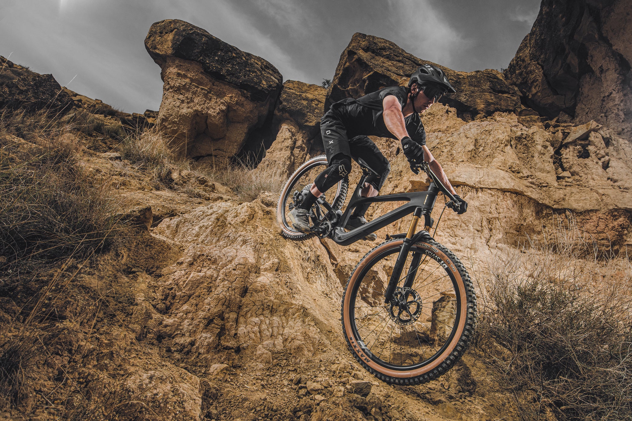 riding a bold linkin mountain bike in a desert landscape